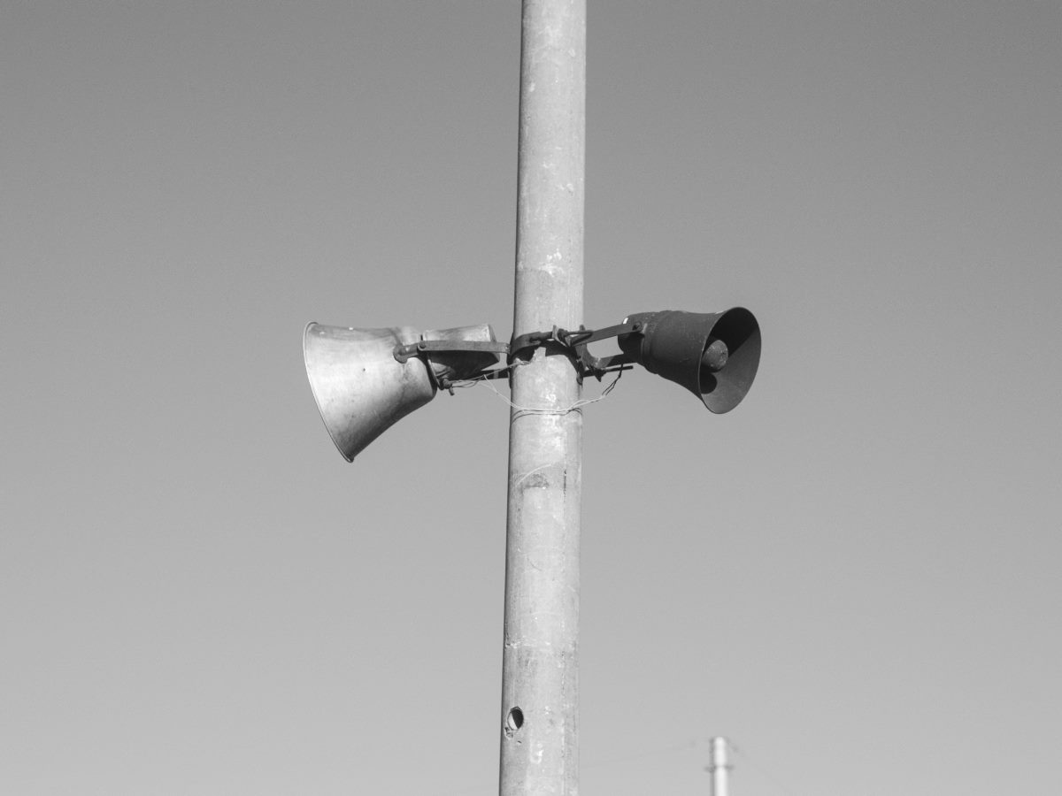 Two megaphones attached to a pole.