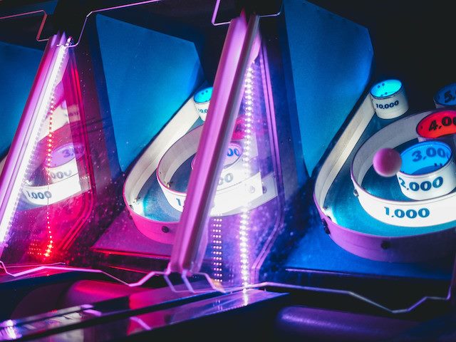 skeeball games lined up in an arcade