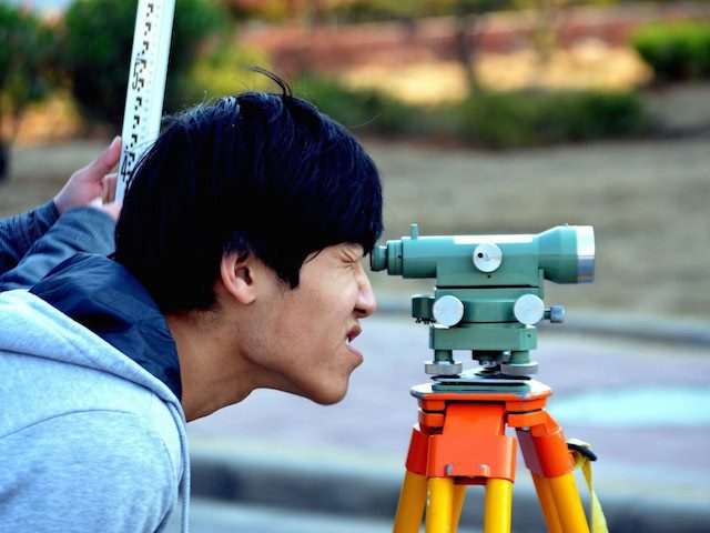surveyor looking at the land