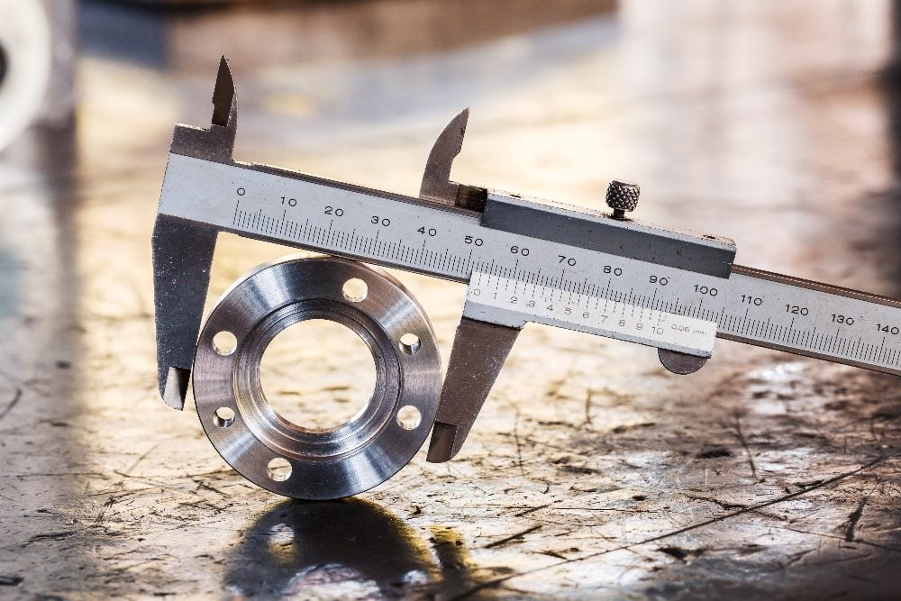 A Vernier caliper taking a measurement in piece about email marketing metrics.