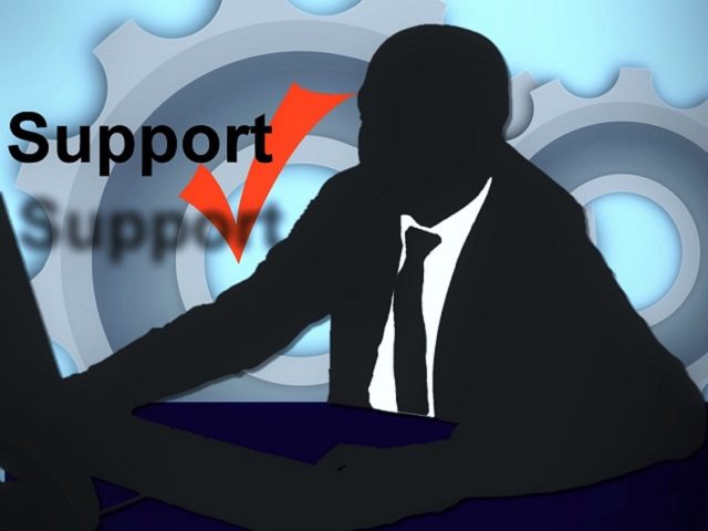 Silhouette of man using customer support.  
