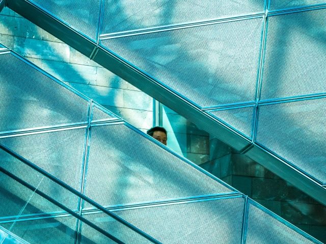 person hidden by a wall
