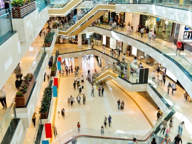  Background of people walking in shopping mall. 