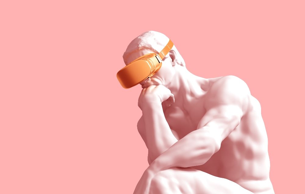 A white marble "Thinker" statue wears a pair of golden VR glasses against a pink background in piece about actionable insights in business.