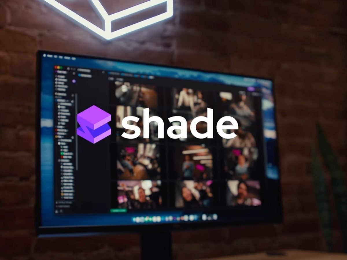 Shade media asset management platform displayed on a desktop monitor with the Shade logo overlaid