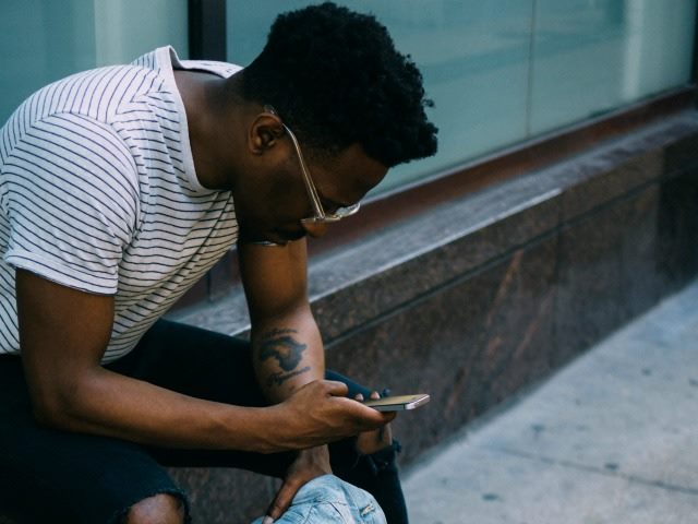 a man studying his phone