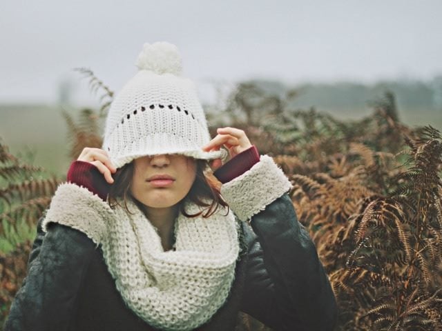 hiding behind a hat