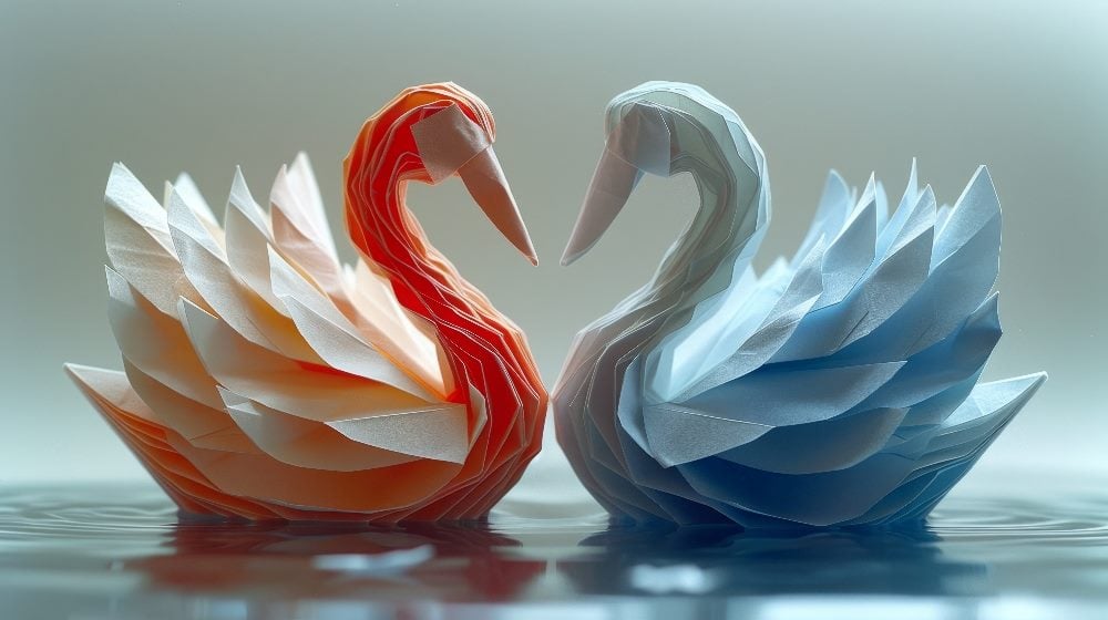 Two intricately folded origami swans facing each other, creating a heart shape between their beaks. One swan is vibrant orange-red, while the other is a soft, icy blue, both sitting on a reflective water surface. The image symbolizes the delicate yet competitive nature of the e-commerce markets, reflecting the strategic interplay between Shein and Temu.