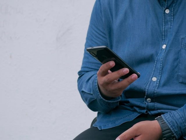 man holding smartphone 