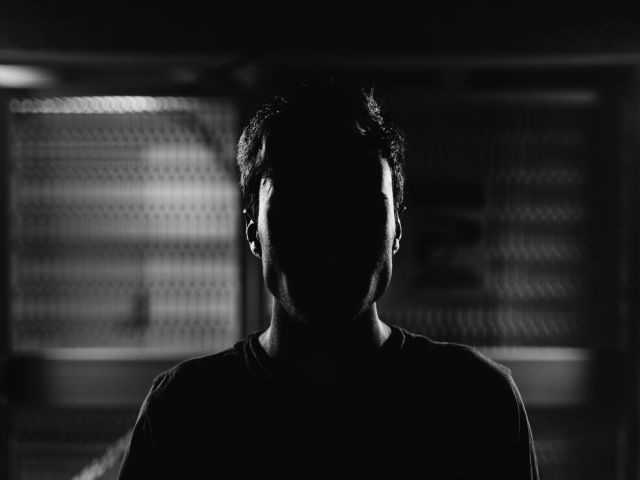 person in darkness