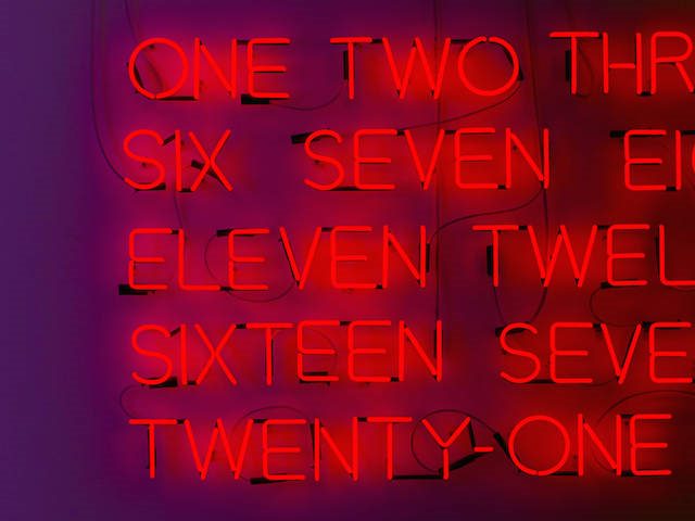 neon sign with numbers written out