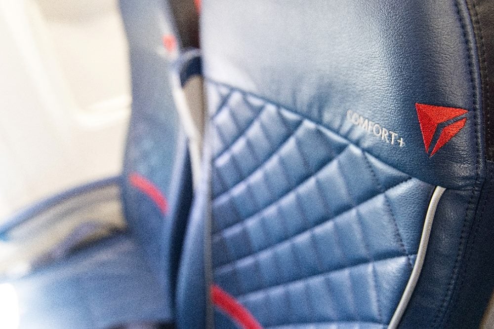Two Delta Airlines airplane seats. Empty.