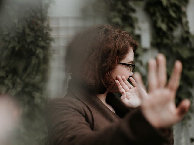 woman hiding her face