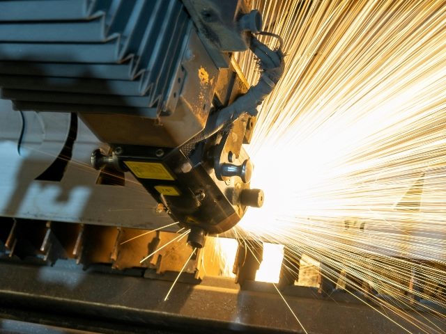Heavy machinery drilling into something that creates sparks.