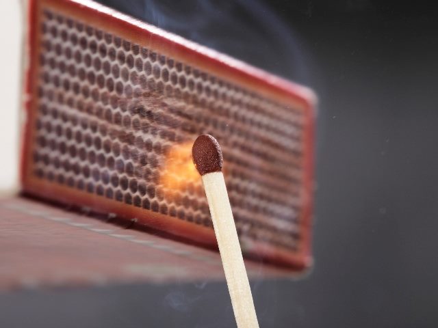 A match is shown being ignited through the use of friction on the matchbox, suggesting the importance of positive friction in CX design. 