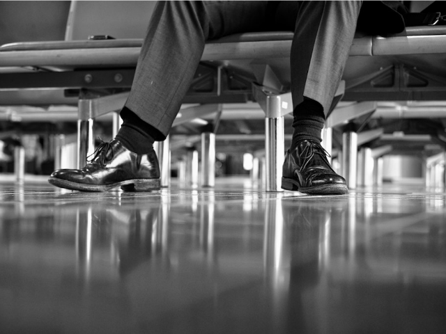 lone man in a room of chairs