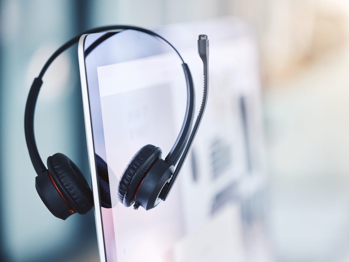 Headset hanging over a computer terminal in a call center.