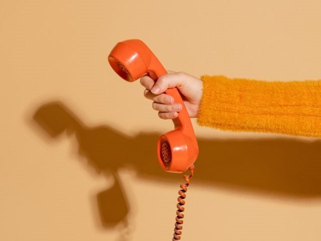 A hand holding a phone