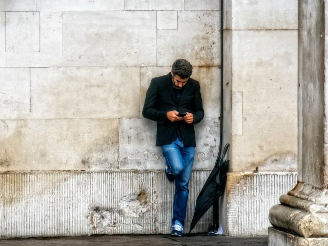 texting by a wall