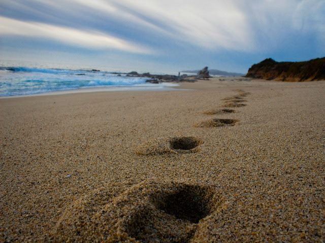 footsteps in sand