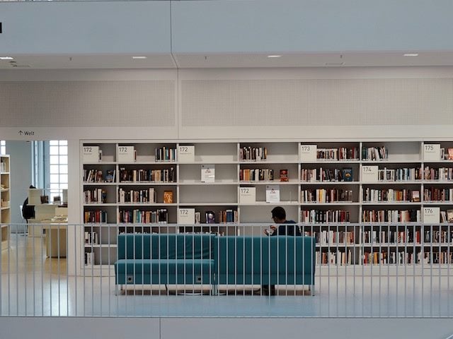 person on a couch in the library