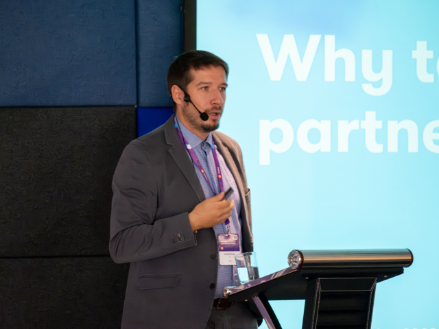 Dominik Pinter speaking at the Kentico event