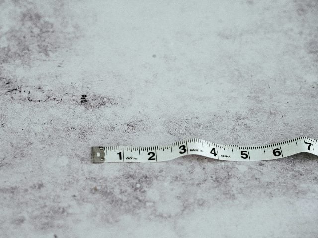 Measuring tape on the ground.