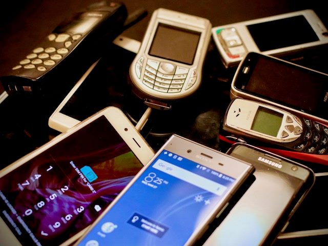 pile of old phones  likely  headed to the dump