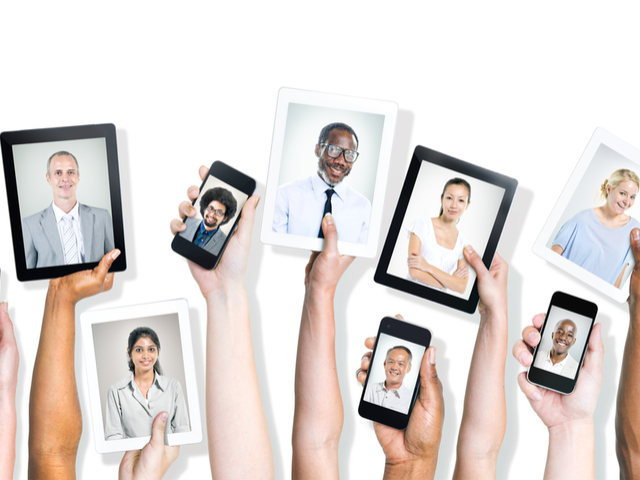 A diverse group of workers each with a head shot on a digital device. - digital workplace personalization concept