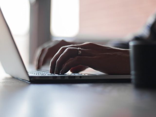 Person using a computer keyboard