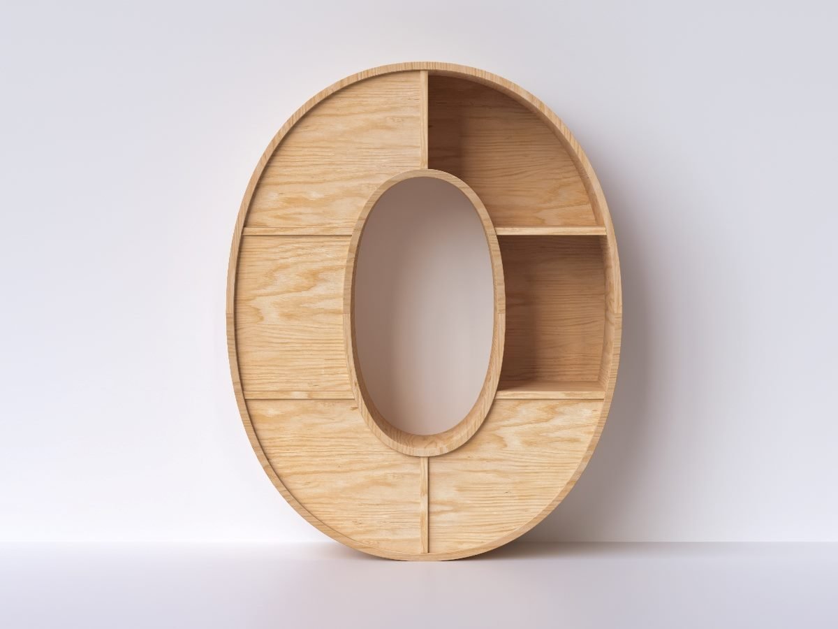 Wooden shelving unit shaped like the number zero, mounted against a white wall, symbolizing the concept of “zero copy” in data architecture.
