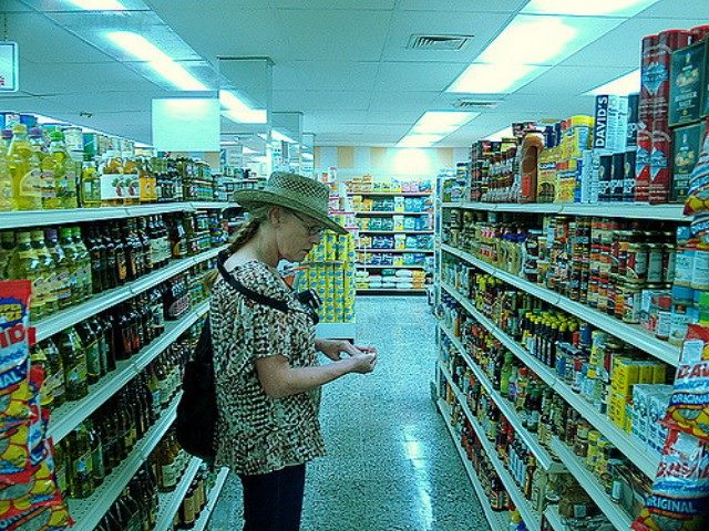 Woman looking at products in a grocery store.