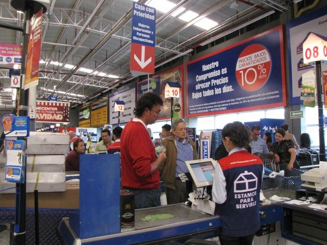 Customers in a checkout line at a home goods store in Bogota, Colombia.