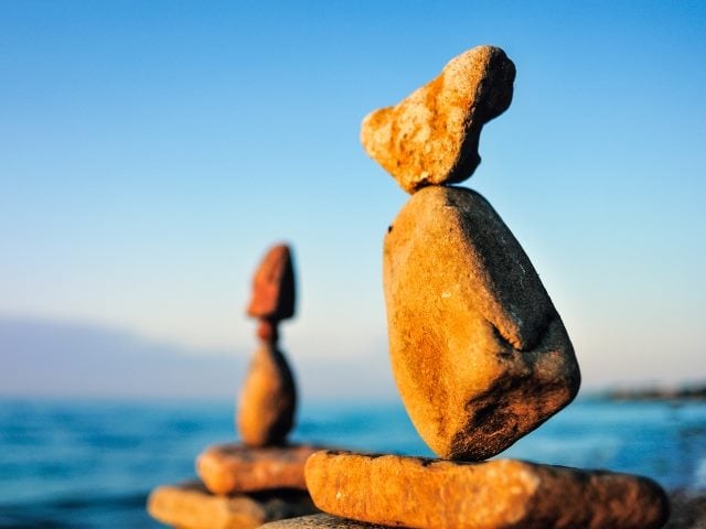 Rocks balancing on rocks near the ocean.