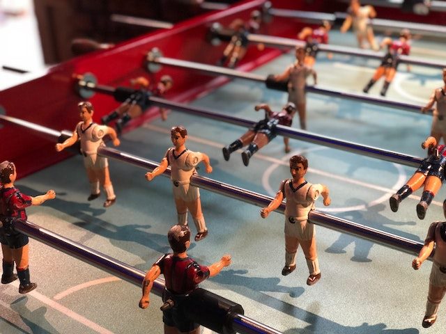 close up of figures  in a foosball table