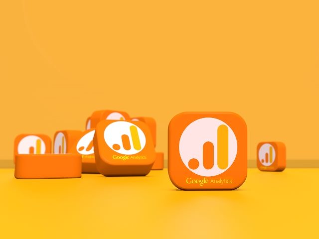 Series of white and three bar gold Google Analytics logos on tiles on lighter gold background symbolizing the evaluation of the GA4 metrics. 