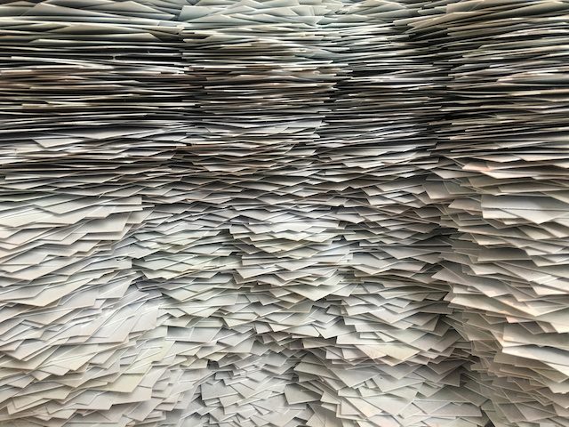 a wall of paperwork