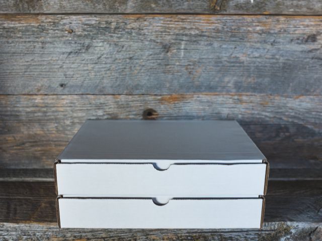 two boxes stacked on top of each other