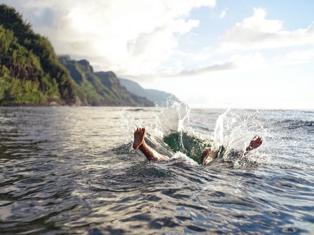 man falling in water