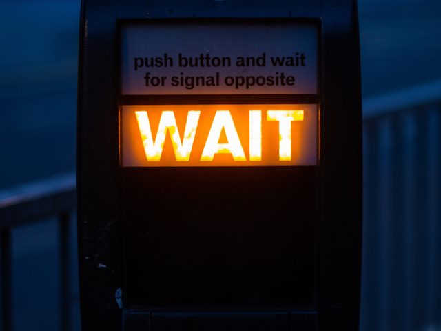 walk signal lit to "Wait"