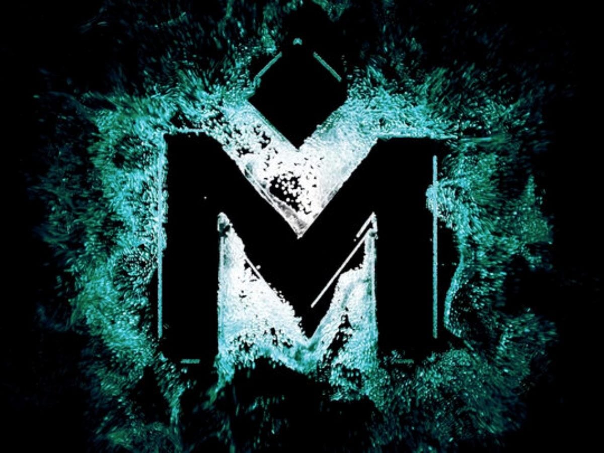Medallia logo displayed in teal and black, with a stylized “M” surrounded by dynamic particle effects, representing data-driven customer experience insights.