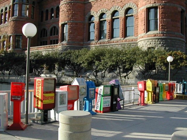 A row of newspaper machines.