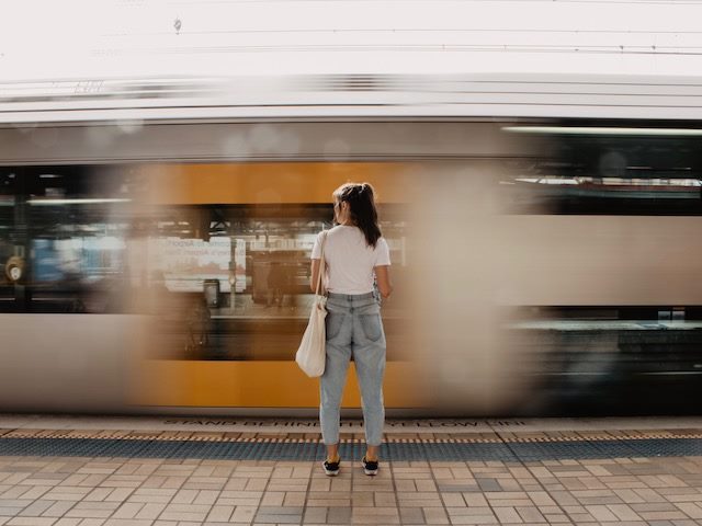 woman watching speeding train go by