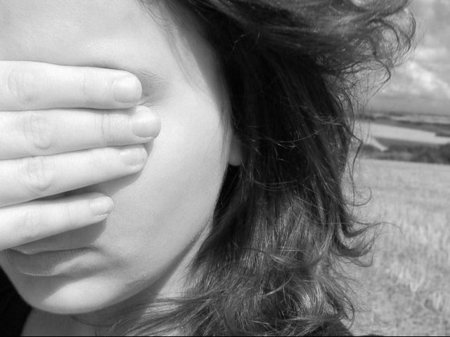 woman closing her eyes