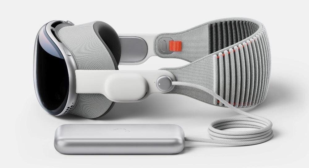 Apple's new Vision Pro high tech glasses lying on a flat surface against a white background.