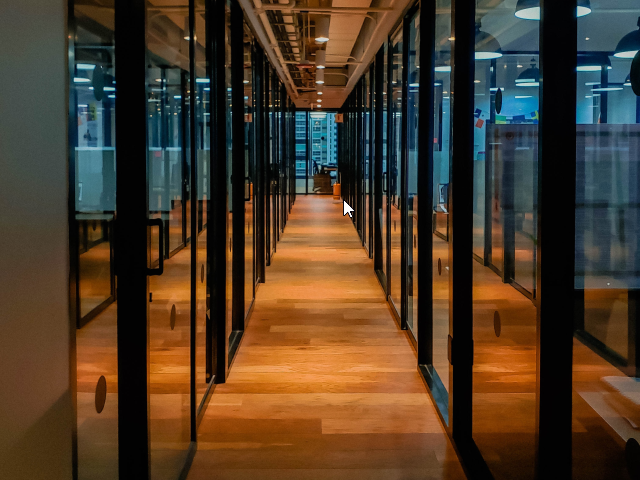 A long and empty workplace hallway - Hybrid Workplace Concept