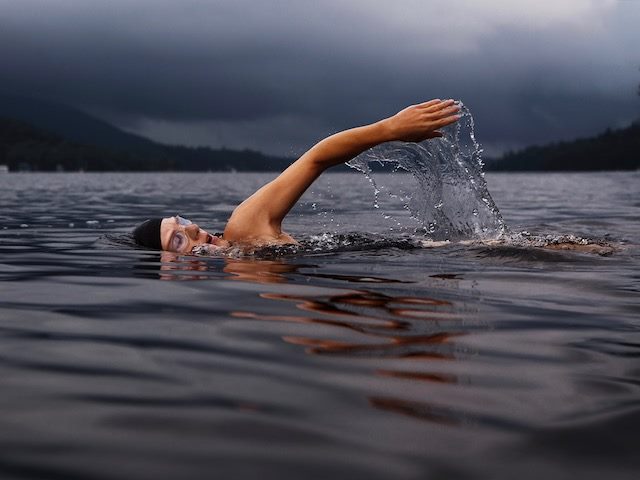 woman swimming in a lake