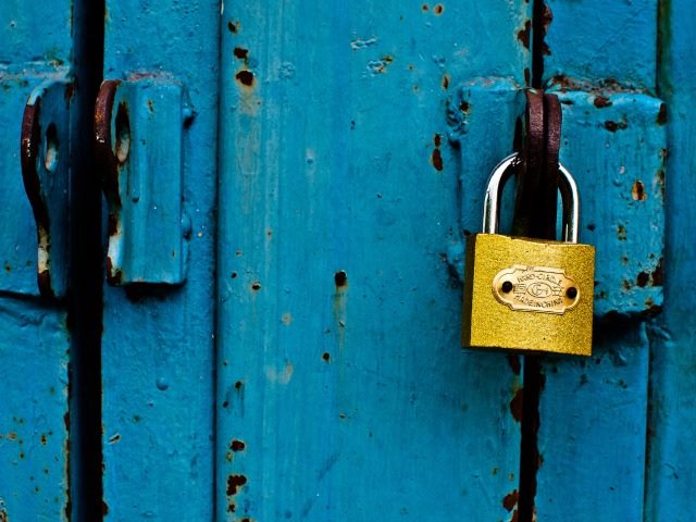 shiny lock against a blue door
