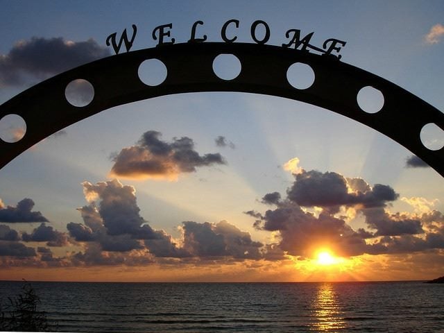 welcome sign with ocean backdrop