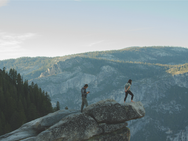 woman on rock ledge